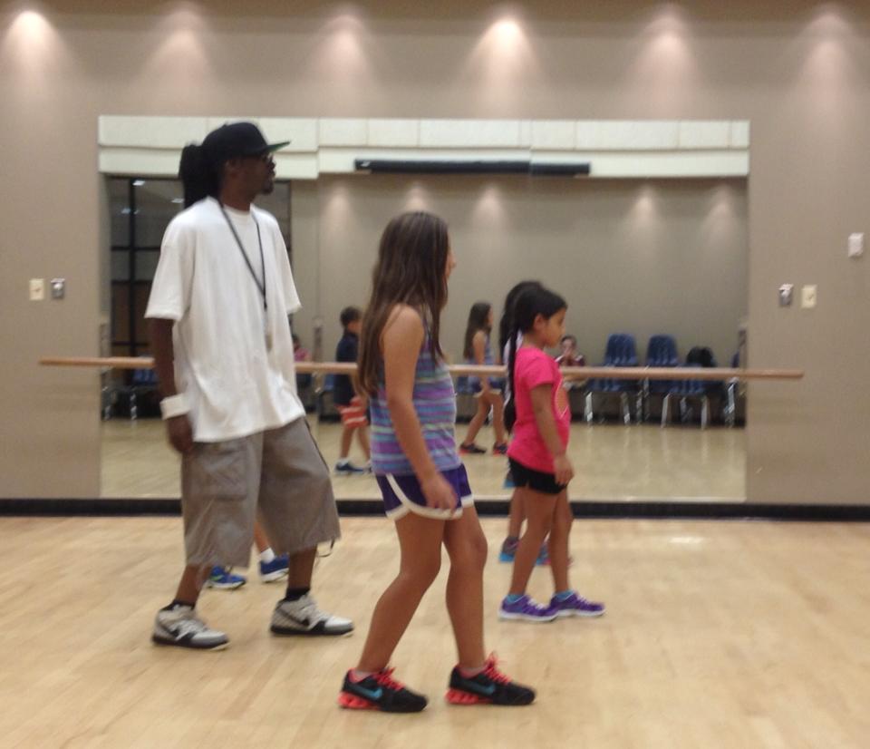 Young students participating in a hip-hop dance class